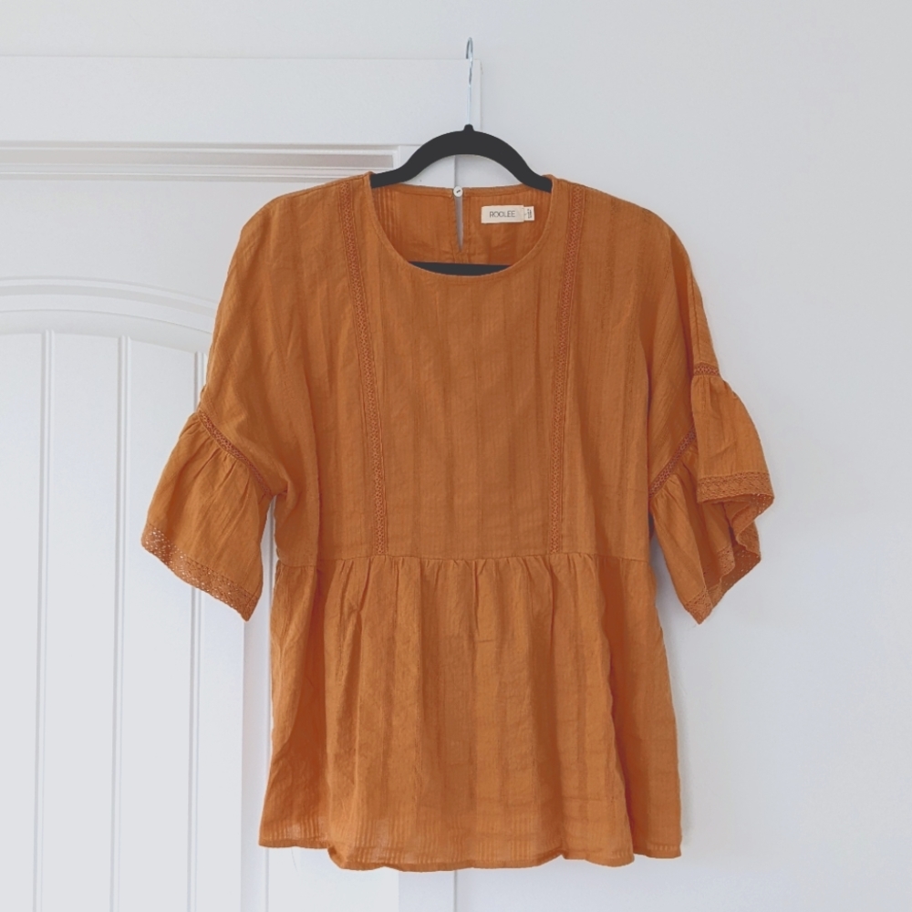 Roolee burnt orange peplum top